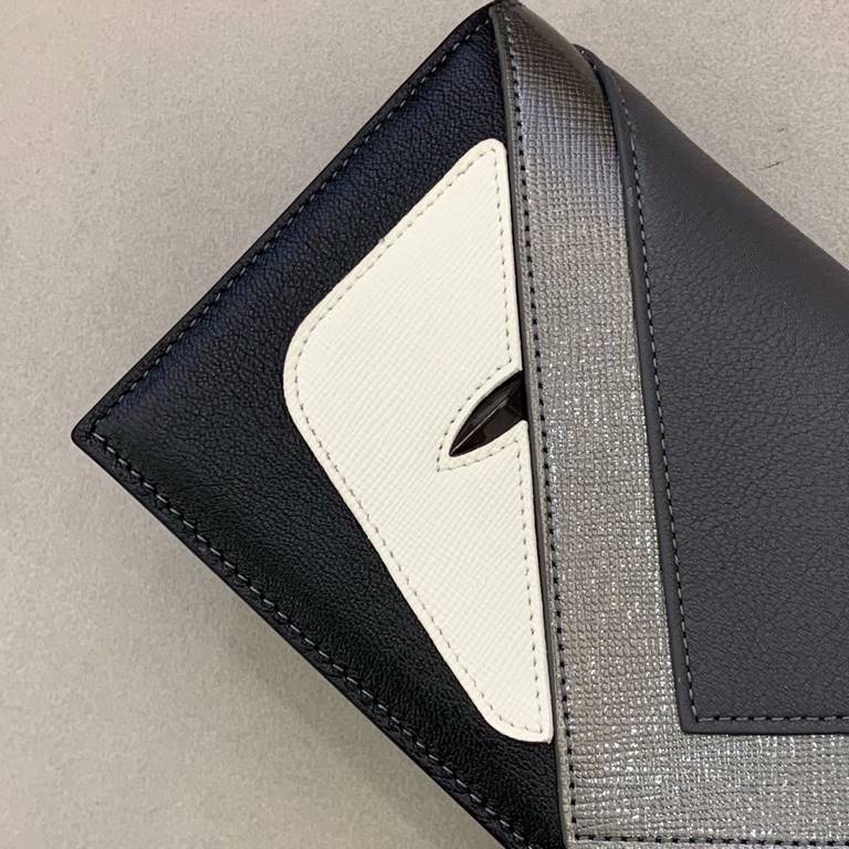 F Family Gun Graphite black and gray calf leather long wallet with color-blocked inserts presenting BAG BUGS eye pattern styling, leather lining, 13 card compartments, 1 large crotch-accessible compartment, flat flap poc