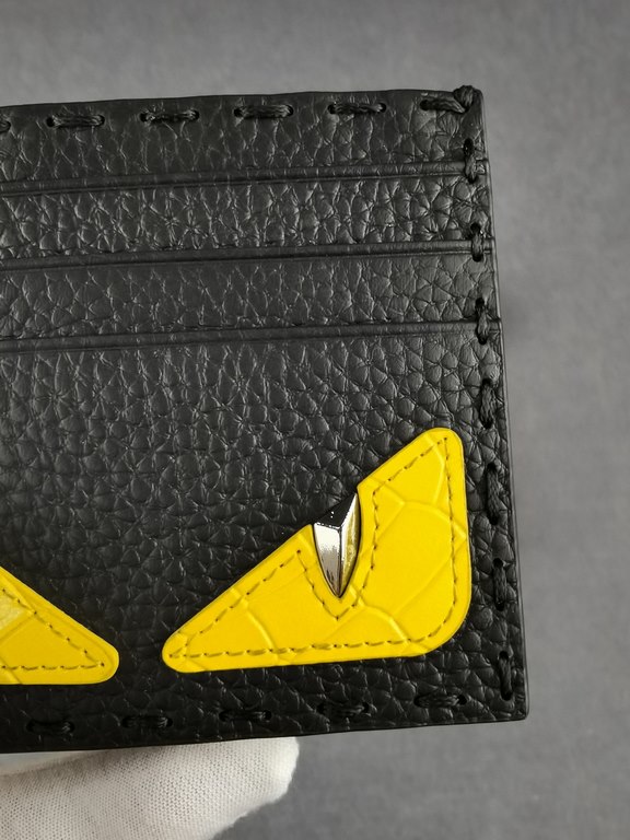 Brand FENDIStyle Stitched Yellow Sticker Card CaseItem No. 2020568Color black   stone pattern yellowMaterial first layer imported Lychee grain cowhide leatherSize 10.59FENDI short clip card bag Introduction 20 years of s