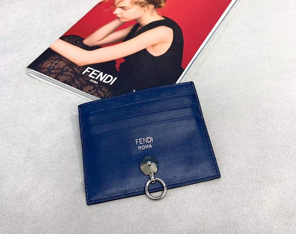 Flat card holder in calf leather, metal rings and chic conical rivets allow the holder to be fastened to a handbag or to a small charm, central compartment and 6 card slots F (box gift bag)Model No. 0260