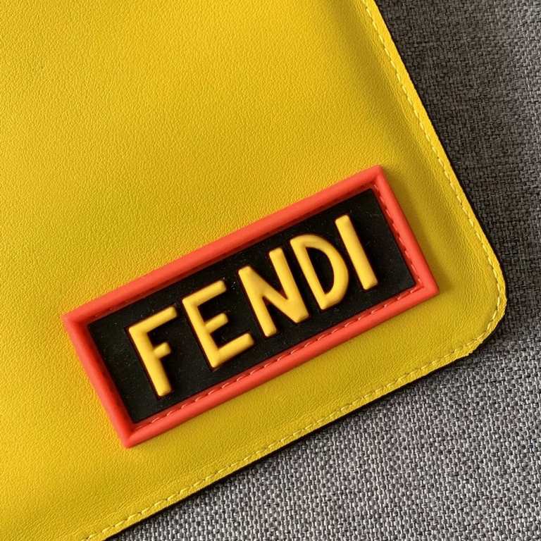 F family thin clutch bag in yellow calf leather, with FEN and THINK lettering on the back with appliqués inspired by the FE VOCABULARY theme and multicolored rubber details, zipper closure and palladium-finish metal hard