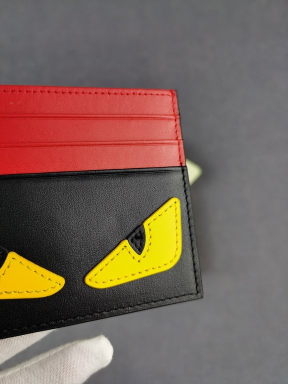 Brand FENDIStyle Black, Red and Yellow Sticker Card CaseItem No. 2020568Color Black RedMaterial First layer imported Napa cow leatherSize 10.59FENDI short clip card bag Introduction 20 years of spring and summer of the l