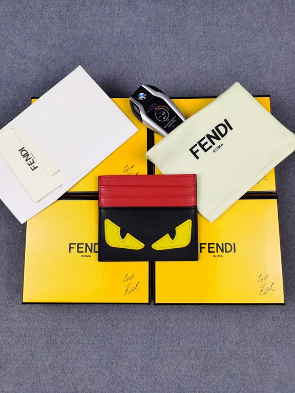 Brand FENDIStyle Black, Red and Yellow Sticker Card CaseItem No. 2020568Color Black RedMaterial First layer imported Napa cow leatherSize 10.59FENDI short clip card bag Introduction 20 years of spring and summer of the l