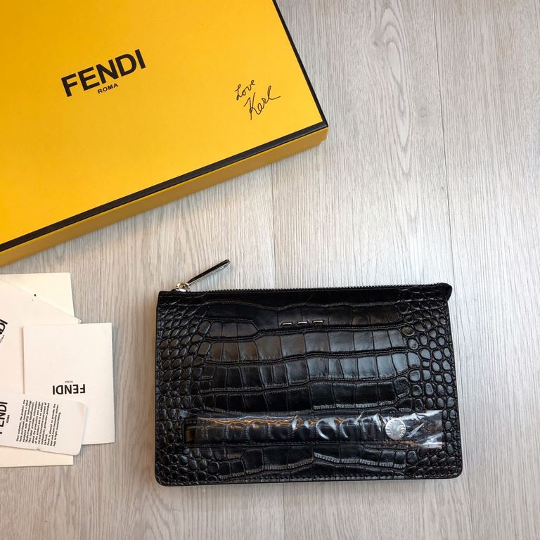 F family Fendi clutch bag in calf leather, decorated with a metallic BAG BUGS eye motif and panels in the same color, 3 internal compartments with 8 card slots, a large crotch-access pocket and an organizer compartment, 