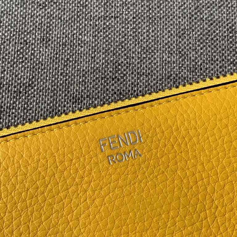 F family Litchi print Roman slim clutch bag with metal appliqués featuring the speechless expression inspired by FACES, zipper closure and microfiber lining. 30cm.