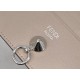 Flat card holder in calf leather, metal rings and chic conical rivets allow the holder to be attached to a handbag or a small charm, with a central compartment and 6 card slots. 18F (box gift bag)Model No. 0269