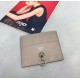 Flat card holder in calf leather, metal rings and chic conical rivets allow the holder to be attached to a handbag or a small charm, with a central compartment and 6 card slots. 18F (box gift bag)Model No. 0269