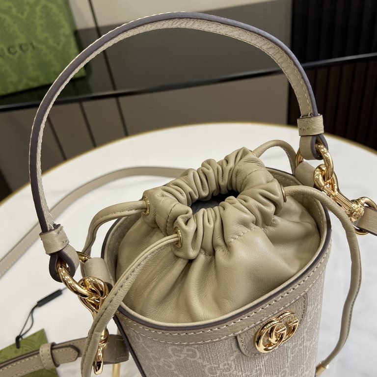 .   Packaged in the original green box   Ophidia Mini Bucket Bag The Ophidia collection has been revitalized in new sizes and styles, combining carry handles and shoulder straps for a versatile carrying experience. The m