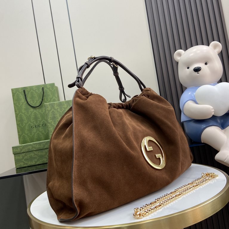 .   With a full set of original green gift bags  Gucci Blondie Collection Large Tote Bag. The Gucci Blondie collection is crafted with the round, interlocking double G's of the brand's iconic design. The Gucci Blondie to