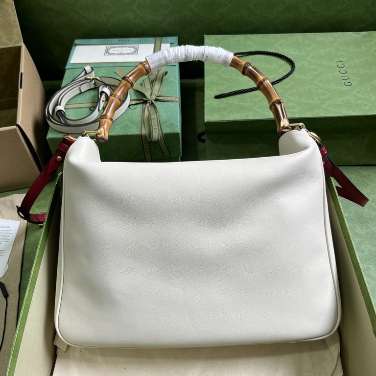 .   With full original green box packaging  Gucci Diana Collection Large Shoulder Backpack. This medium shoulder bag combines two of the brand's most recognizable elements - the bamboo handle and the double G - to give t