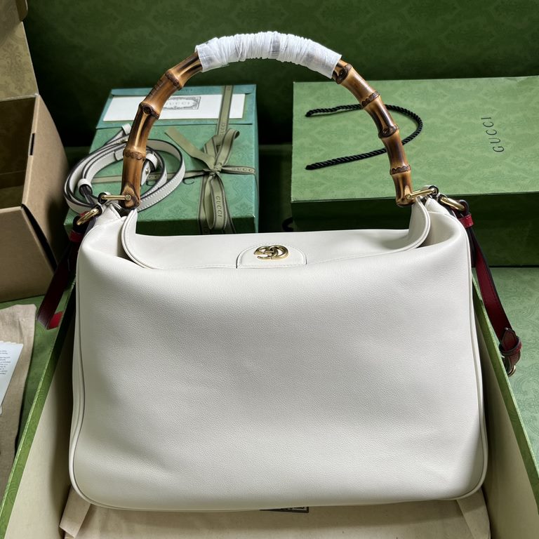 .   With full original green box packaging  Gucci Diana Collection Large Shoulder Backpack. This medium shoulder bag combines two of the brand's most recognizable elements - the bamboo handle and the double G - to give t