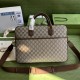 .   Packaged with original green gift bag  GG Briefcase  Crafted from GG Supreme canvas with brown leather piping, this structured and stiff briefcase   offers dual carrying options of a top handle and shoulder strap.Mod