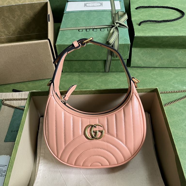 .  With full set of original green box packaging GG Marmont series quilted mini handbag.Gucci's classic pieces continue to reinvigorate themselves around the brand's evolving aesthetic. Sunset orange shines in the Spring