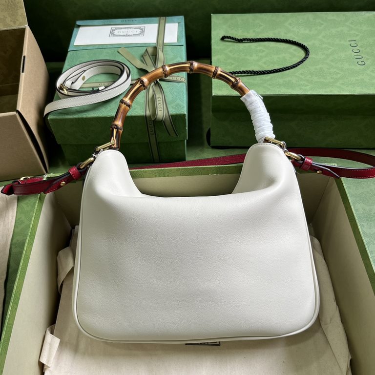 .   Comes with a full set of original green box packaging  Gucci Diana Collection Medium Shoulder Backpack. The small shoulder bag combines two of the brand's most recognizable elements - the bamboo handle and the double