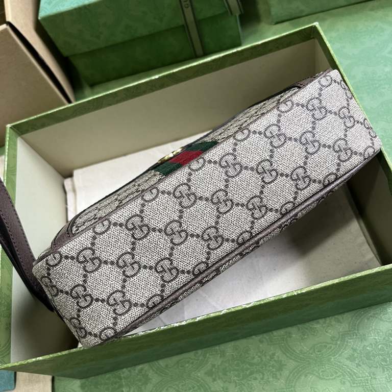 .   Packaged in the original green box   Ophidia GG Clutch Bag. The Ophidia collection blends the best of Gucci's heritage with modern design to create an eye-catching new piece. Crafted in brown and beige GG Supreme can