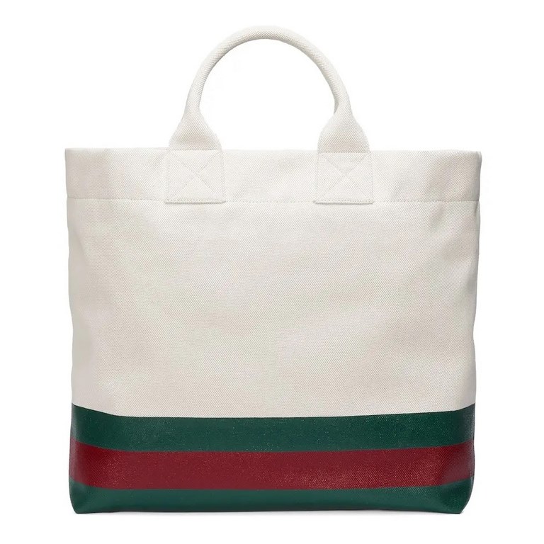 embellished embossed detail canvas tote bagModel No. 779510 FAC4W 8477779510 fac4w 8477From Gucci's Lido collection, this piece is inspired by the Italian coast's summer flavor and beach clubs. Crafted in a casual silhou