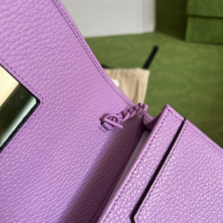 .   Packaged in a full set of original green boxes   This chain strap wallet from the GG Marmont collection revitalizes a design from previous collections and is crafted in a crisp lilac leather, bringing a stunning piec