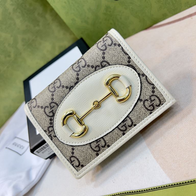 New to the      SpringSummer collection is the Gucci    1955 Horsebit Card Case in GG Supreme premium faux canvas and brown leather. This detail is inspired by the brand's equestrian roots and is part of Gucci's classic 