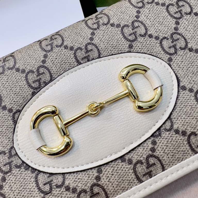 New to the SpringSummer collection is the Gucci 1955 Horsebit Card Case made of GG Supreme premium faux canvas and brown leather.The collection features the same double ring and long stripes as the handbag.This detail is