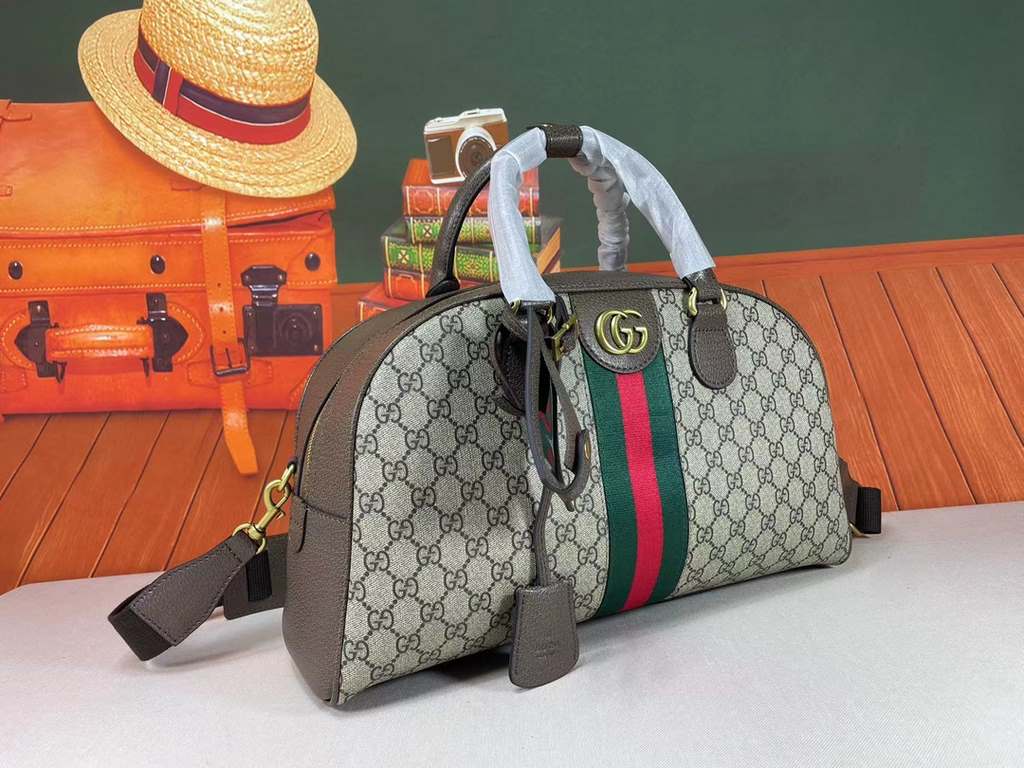 The Gucci Savoy Medium Bowling Bag makes a bold statement with the brand's recognizable GG pattern and striped webbing. The Gucci Savoy collection continues to evolve on the Gucci Star Talk runway, with new colorways rei