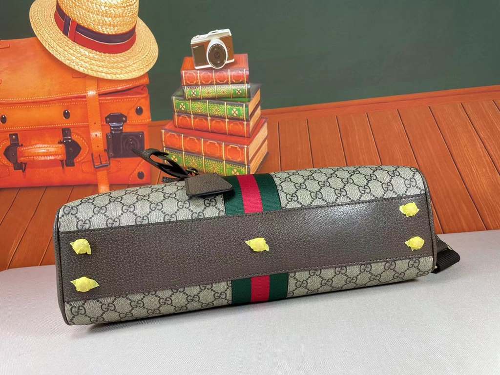 The Gucci Savoy Medium Bowling Bag makes a bold statement with the brand's recognizable GG pattern and striped webbing. The Gucci Savoy collection continues to evolve on the Gucci Star Talk runway, with new colorways rei