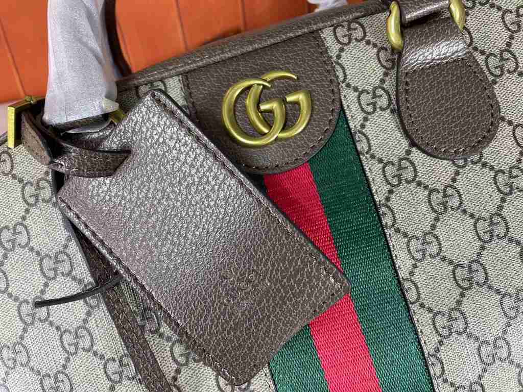 The Gucci Savoy Medium Bowling Bag makes a bold statement with the brand's recognizable GG pattern and striped webbing. The Gucci Savoy collection continues to evolve on the Gucci Star Talk runway, with new colorways rei