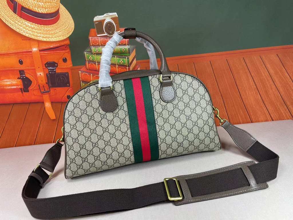 The Gucci Savoy Medium Bowling Bag makes a bold statement with the brand's recognizable GG pattern and striped webbing. The Gucci Savoy collection continues to evolve on the Gucci Star Talk runway, with new colorways rei