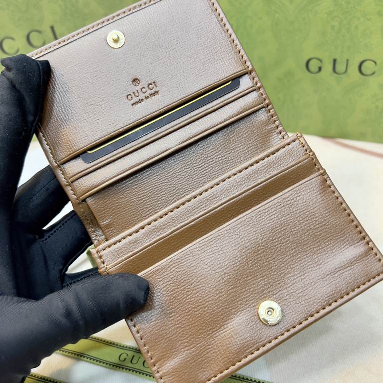 New to the      SpringSummer collection is the Gucci    1955 Horsebit Card Case in GG Supreme premium faux canvas and brown leather. This detail is inspired by the brand's equestrian roots and is part of Gucci's classic 