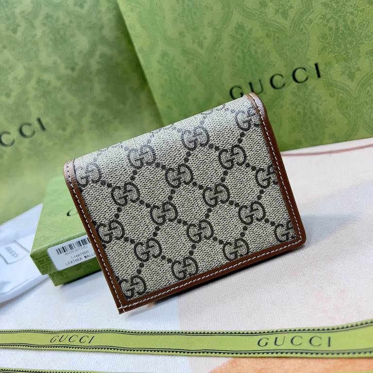 New to the      SpringSummer collection is the Gucci    1955 Horsebit Card Case in GG Supreme premium faux canvas and brown leather. This detail is inspired by the brand's equestrian roots and is part of Gucci's classic 