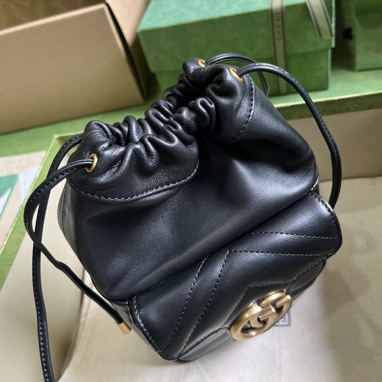 .   Comes with a full set of original green box packaging  GG Marmont Collection Mini Bucket Bag. This mini bucket bag is crafted in black quilted V-shaped leather. A signature element of the GG Marmont collection, the g