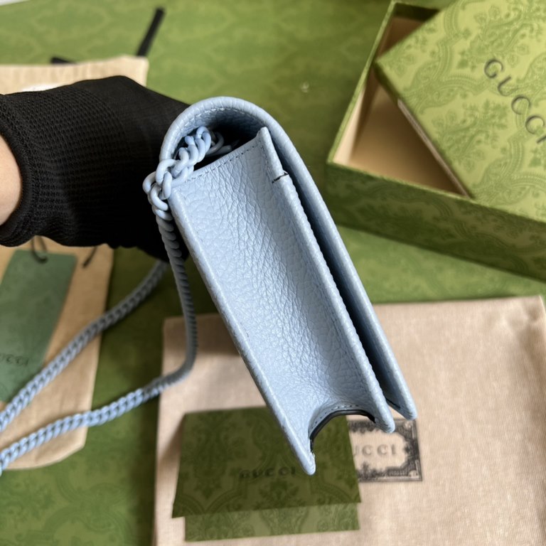 .   Comes in a full set of original green box packaging   This GG Marmont chain wallet revitalizes designs from previous collections and is crafted in crisp light blue leather, bringing a stunning piece to the Gucci Marc