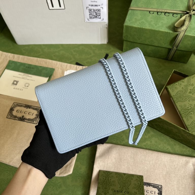 .   Comes in a full set of original green box packaging   This GG Marmont chain wallet revitalizes designs from previous collections and is crafted in crisp light blue leather, bringing a stunning piece to the Gucci Marc