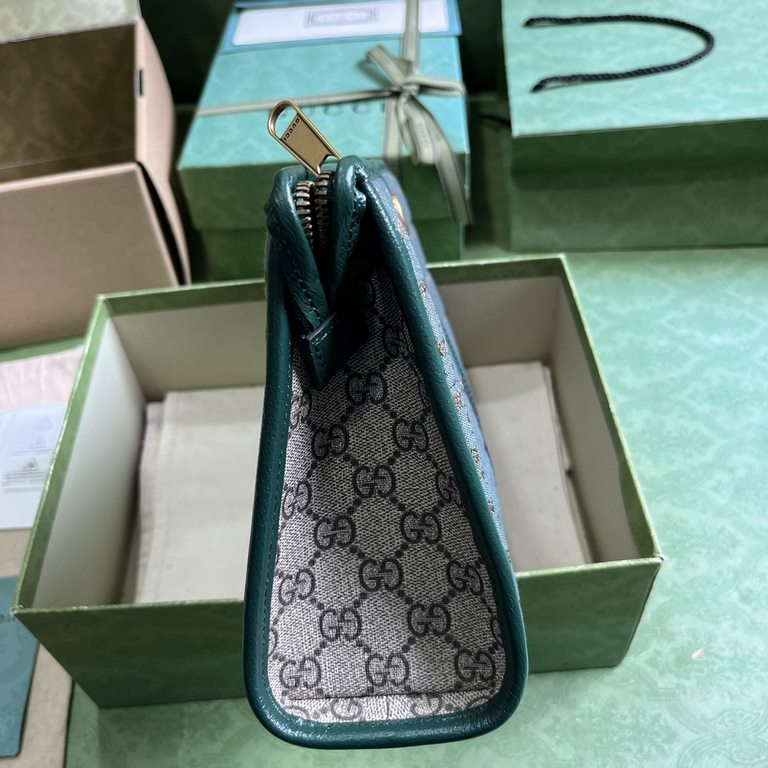 .   with full original green box packaging  Mini GG Canvas Clutch Bag.Gucci's small leather accessories push the boundaries of design and continue to reinterpret classic travel pieces in a personalized way. This men's cl