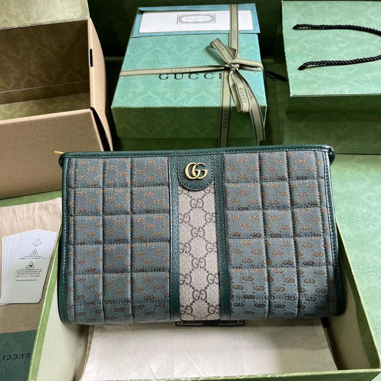 .   with full original green box packaging  Mini GG Canvas Clutch Bag.Gucci's small leather accessories push the boundaries of design and continue to reinterpret classic travel pieces in a personalized way. This men's cl