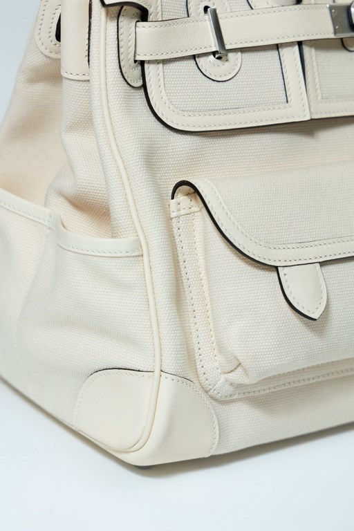 35 Cargo Cloth Bag Detail Color Cream White. Hardware silver buckle (Size 35 x 25 x 18 cm) Canvas spliced with slip leather Swift Very small production A style that becomes more and more vintage the more you use it What'