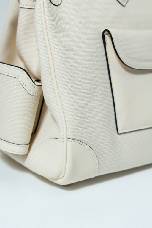 35 Cargo Cloth Bag Detail Color Cream White. Hardware silver buckle (Size 35 x 25 x 18 cm) Canvas spliced with slip leather Swift Very small production A style that becomes more and more vintage the more you use it What'