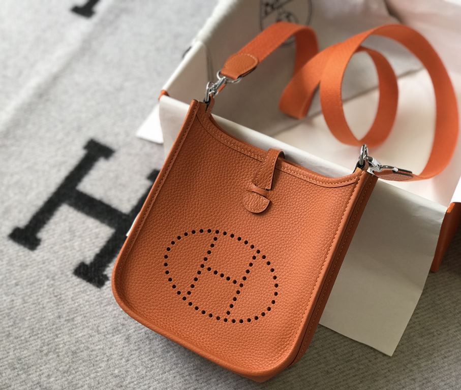 . Vibrant OrangeSelf-fabricated shoulder strap   togo cowhide leather   minimalist style.