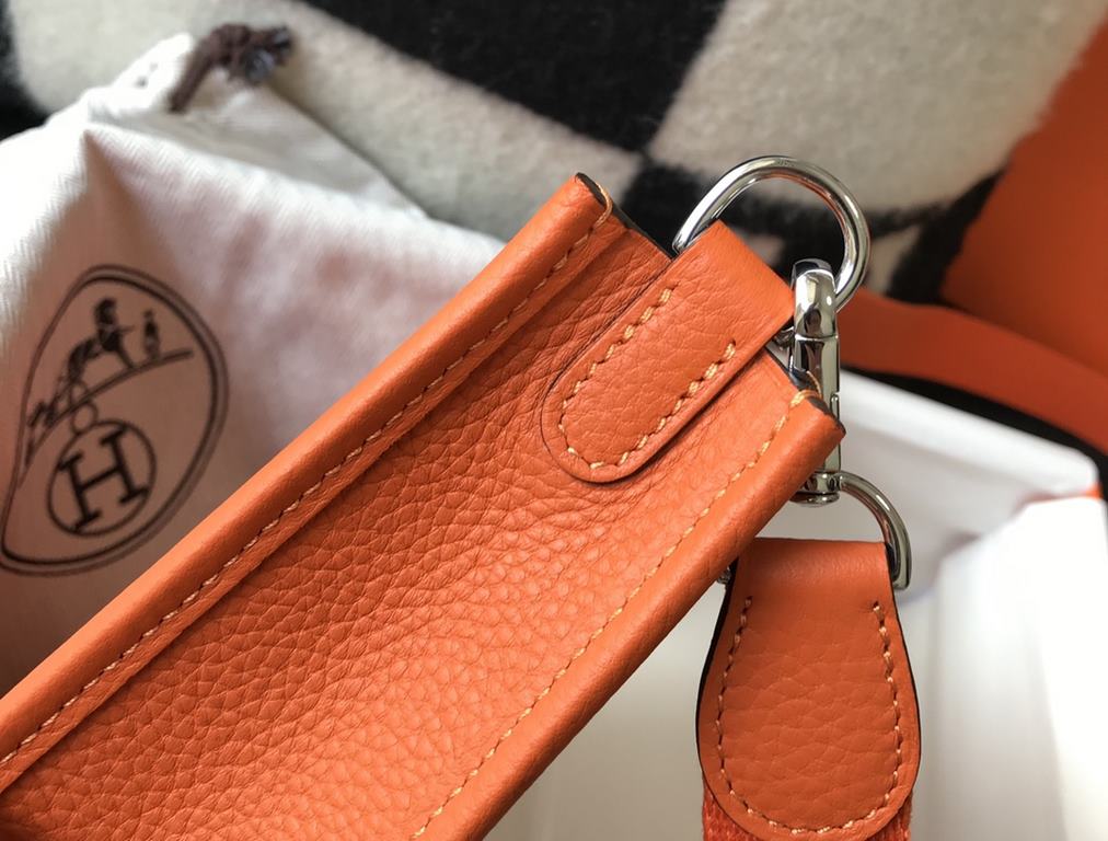 . Vibrant OrangeSelf-fabricated shoulder strap   togo cowhide leather   minimalist style.