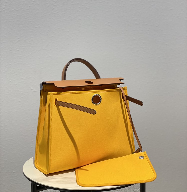 Herbag Amber YellowSuper handsome commuter bag, between casual and formal, casual without losing elegance, the combination of canvas and cowhide  leather, the outer seam is hard and stylish.Super high cost-effective in st