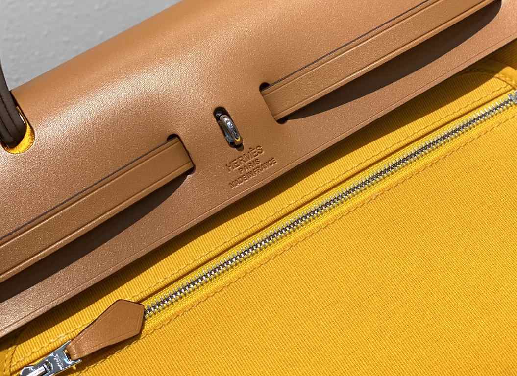 Herbag Amber YellowSuper handsome commuter bag, between casual and formal, casual without losing elegance, the combination of canvas and cowhide  leather, the outer seam is hard and stylish.Super high cost-effective in st