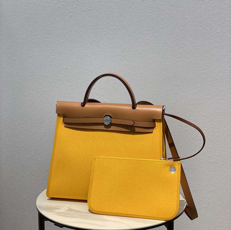 Herbag Amber YellowSuper handsome commuter bag, between casual and formal, casual without losing elegance, the combination of canvas and cowhide  leather, the outer seam is hard and stylish.Super high cost-effective in st