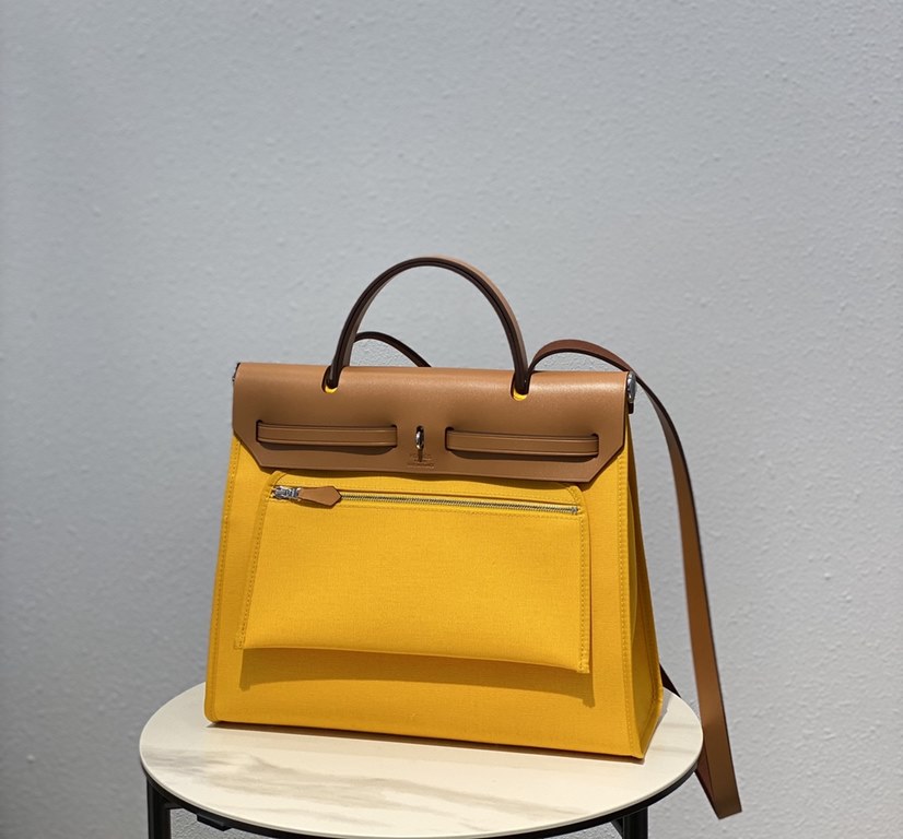 Herbag Amber YellowSuper handsome commuter bag, between casual and formal, casual without losing elegance, the combination of canvas and cowhide  leather, the outer seam is hard and stylish.Super high cost-effective in st