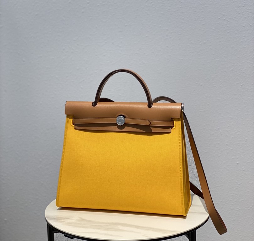 Herbag Amber YellowSuper handsome commuter bag, between casual and formal, casual without losing elegance, the combination of canvas and cowhide  leather, the outer seam is hard and stylish.Super high cost-effective in st