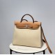 Herbag Creamy AlmondSuper handsome commuter bag, between casual and formal, casual without losing elegance, the combination of canvas and cowhide  leather, the outer seams are stiff and stylish.The combination of canvas a