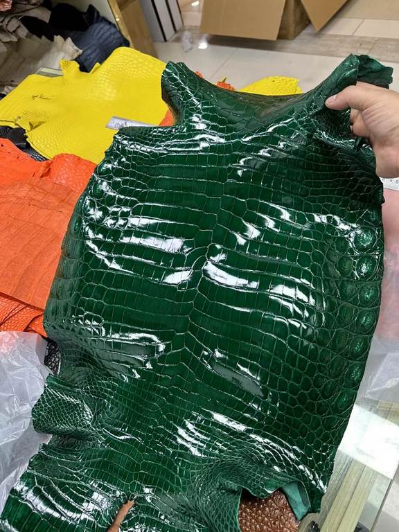 Glossy Nile crocodile skin, if you need it, chat with me.