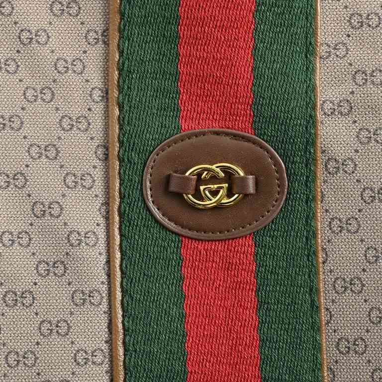 Gucci  Gucci Half Zip Double G Full Print Webbing JacketA dual design of jumper and jacket, this piece is crafted in a mini GG plain knit fabric with classic brand detailing, a striped webbing element on the front that d