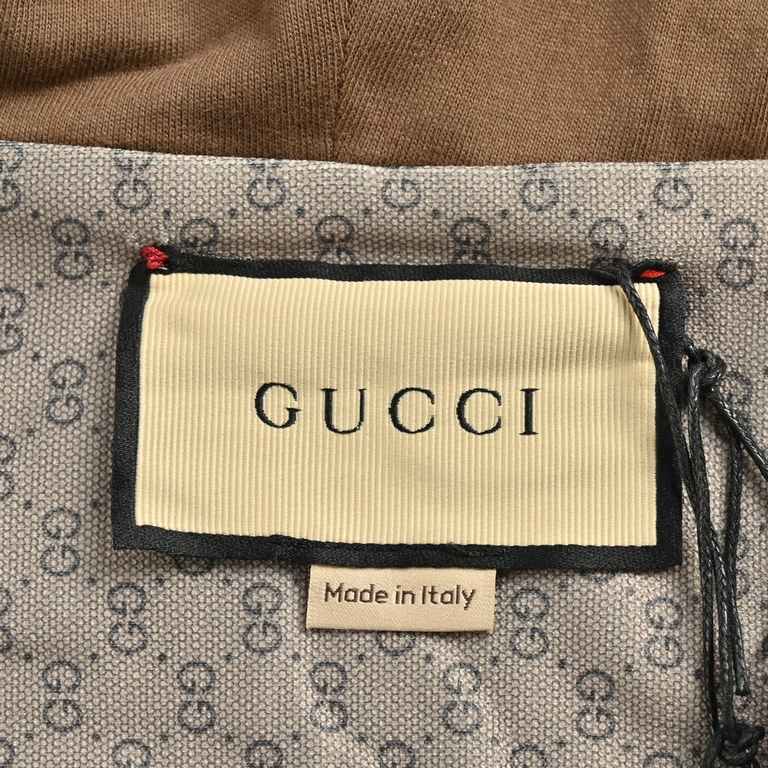 Gucci  Gucci Half Zip Double G Full Print Webbing JacketA dual design of jumper and jacket, this piece is crafted in a mini GG plain knit fabric with classic brand detailing, a striped webbing element on the front that d