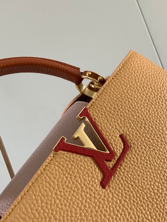 M59466 apricot yellow with light earthy gold clasp]A modern clash of shades in full-grain cowhide leather, this medium Capucines bag features the iconic LV alphabet and side loops, top handles and a detachable shoulder s