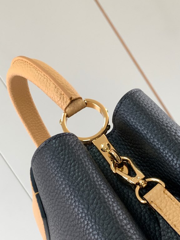 M59466 Black with Apricot Gold Buckle]A modern clash of shades in full-grain cowhide leather, this medium Capucines bag features the iconic LV alphabet and side loops, top handles and a detachable shoulder strap for vers