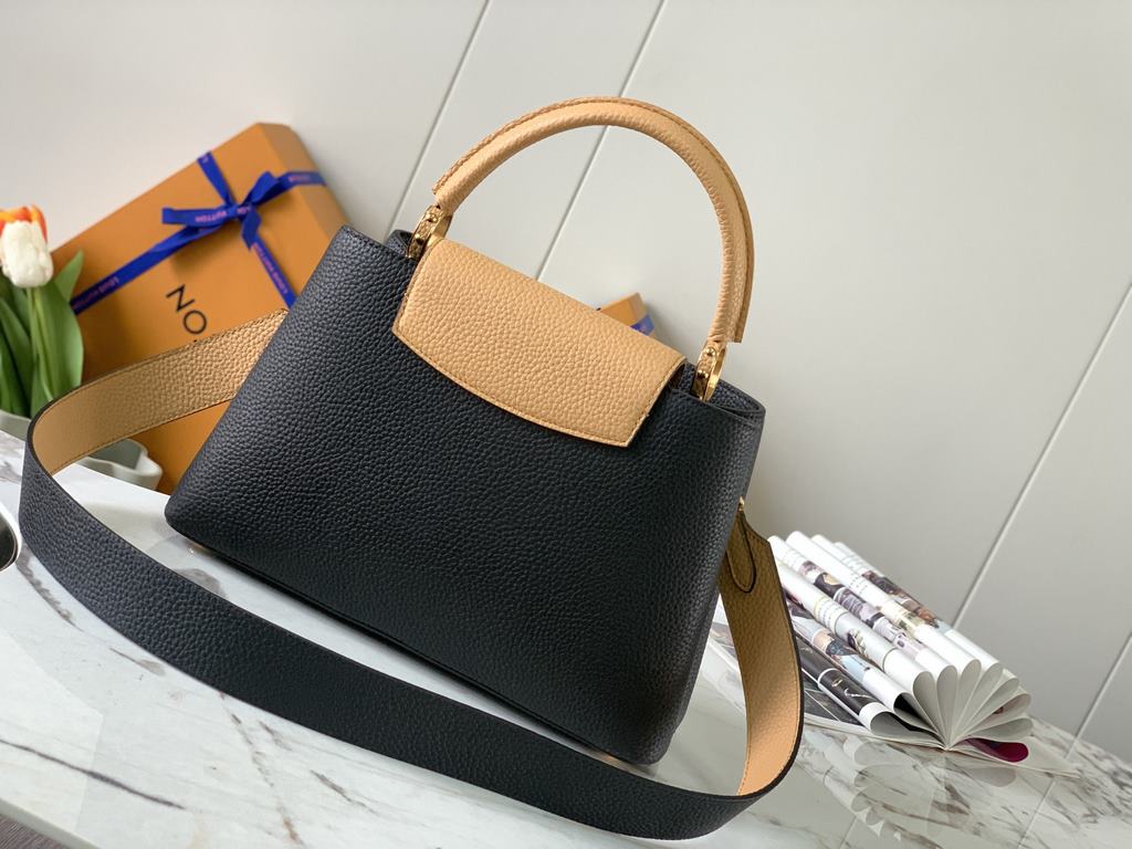 M59466 Black with Apricot Gold Buckle]A modern clash of shades in full-grain cowhide leather, this medium Capucines bag features the iconic LV alphabet and side loops, top handles and a detachable shoulder strap for vers