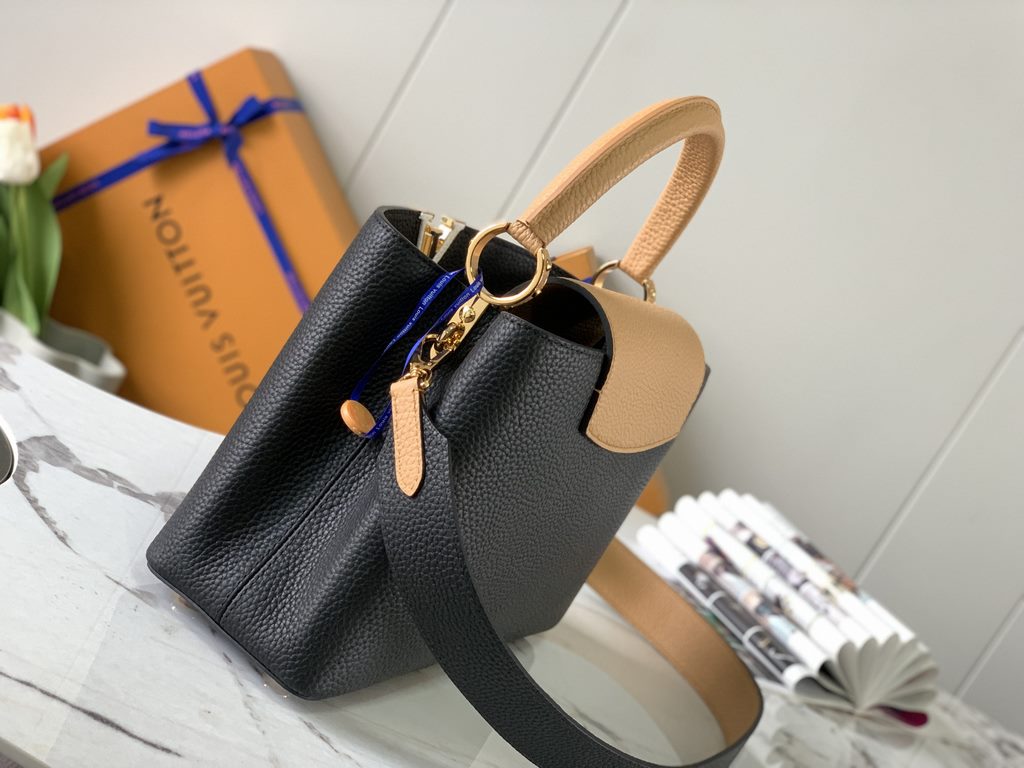 M59466 Black with Apricot Gold Buckle]A modern clash of shades in full-grain cowhide leather, this medium Capucines bag features the iconic LV alphabet and side loops, top handles and a detachable shoulder strap for vers